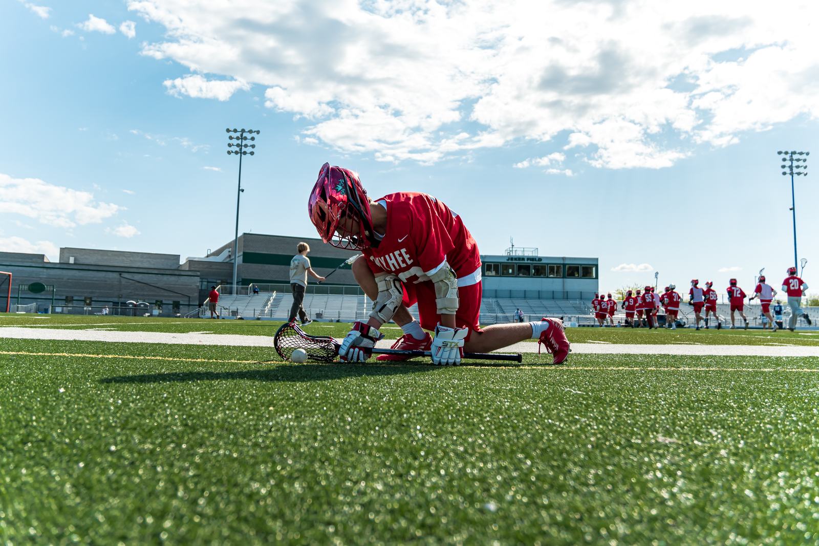A Storm player takes a knee on the sideline before warmups